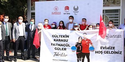 OLİMPİYAT  ŞAMPİYONU  ÇİÇEKLERLE KARŞILANDI